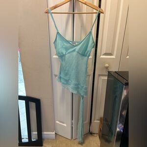 Beautiful sheer asymmetrical camisole in aqua blue. Size L